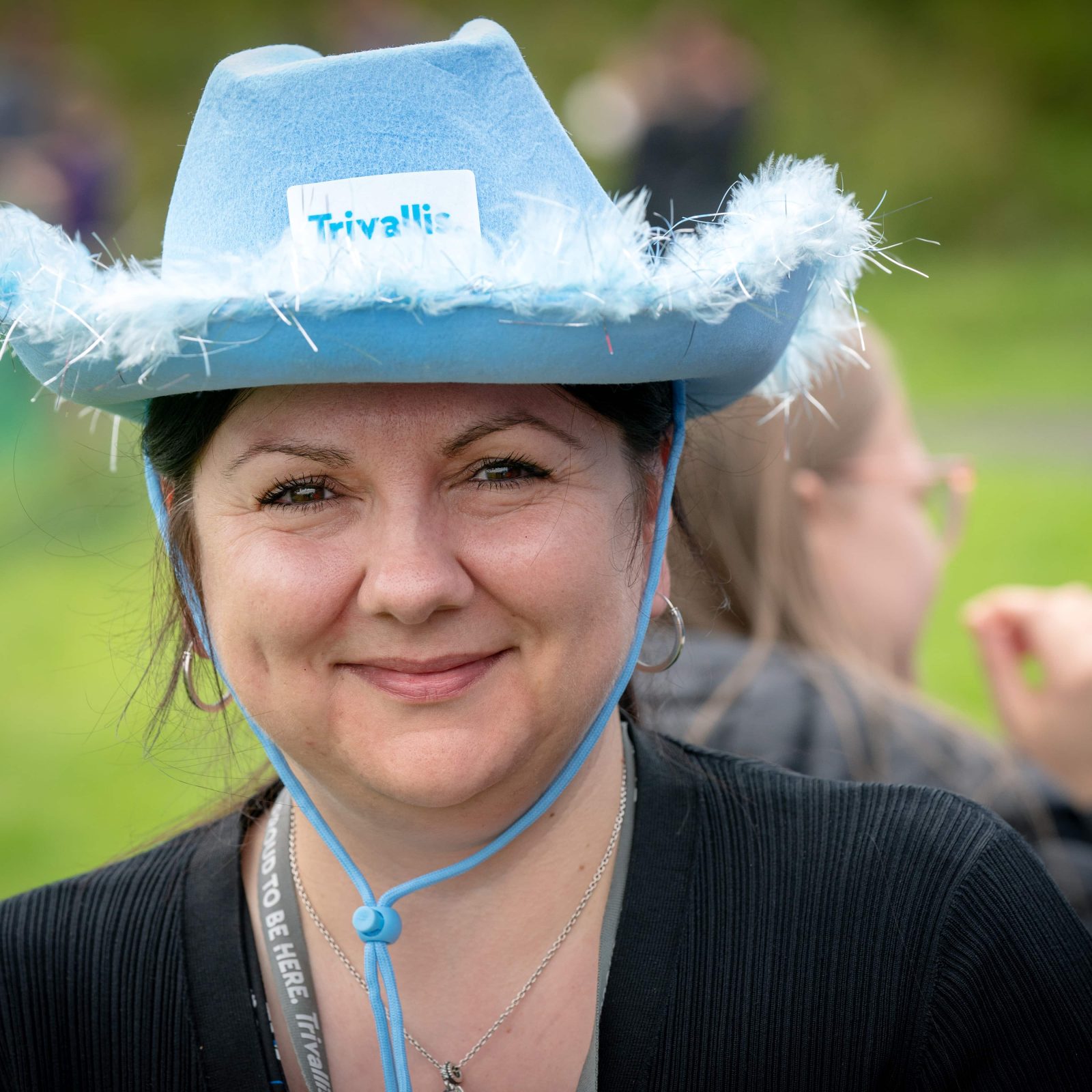 Trivallis Housing Landlord Wales A woman is wearing a blue hat with a 