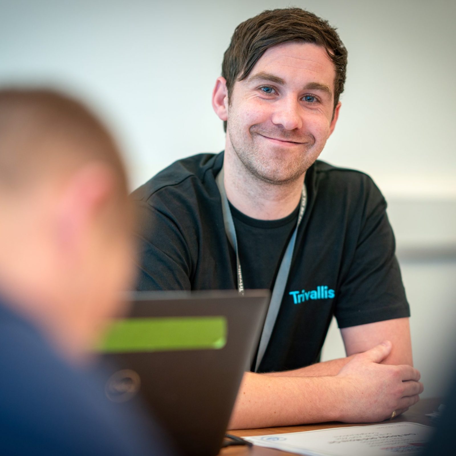 Trivallis Housing Landlord Wales A smiling man wearing a black t-shirt with the logo 